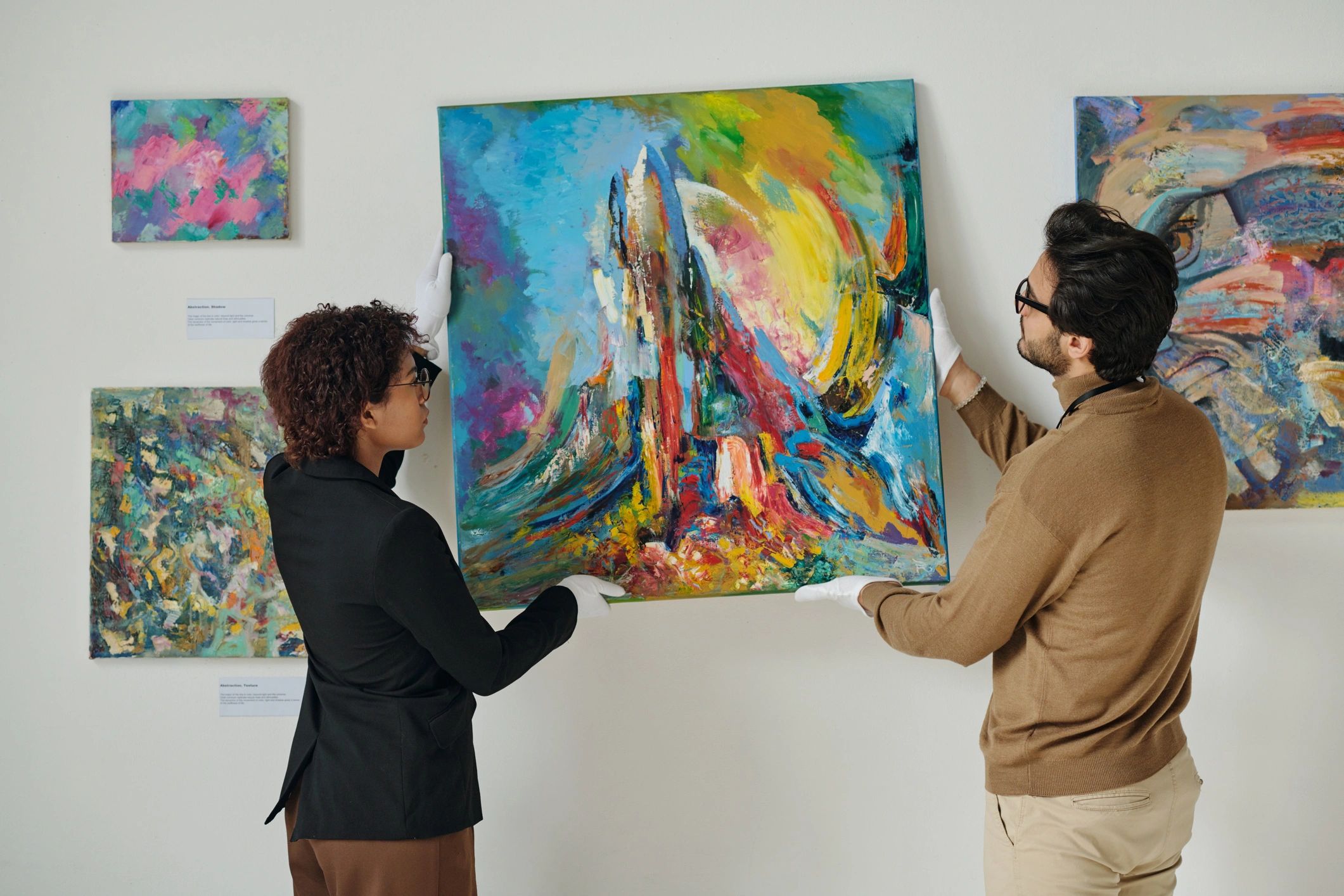 art collectors viewing artwork